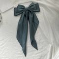 Elegant large dark green satin bow hair clip with long ribbons on white fabric - Teal