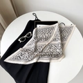 Detailed view of beige pleated satin scarf featuring black leopard print pattern - 70cm / Beige Leopard