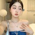 Chic silver hoop earrings and heart necklace set styled with a denim top - Hot Girl Hoop Earrings (Silver Large Circles)