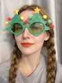 Close-up of a person wearing festive green Christmas tree party glasses with pom-poms - Large Christmas Tree