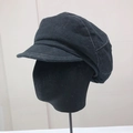 Side view of black newsboy cap featuring decorative white topstitching on the brim and crown - Black