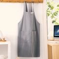 Gray cotton linen apron with front pocket and halter strap in minimalist home setting - Gray