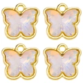 Close-up of four butterfly charms with gold metal frame and iridescent white crystals - AB White