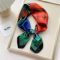 Elegant geometric silk scarf with bold color blocks displayed in a golden frame - Green Knit Print