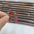 Close-up of red and green plaid fabric bows with bells for Christmas decoration - Style 8