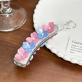 Gray acetate banana hair clip featuring pink and blue rhinestoned floral accents - Gray