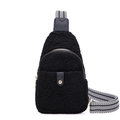 Detail of black faux shearling belt bag with geometric pattern strap and metal zipper - Black
