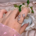 Detail of silver star chain ring with shimmering cubic zirconia on silk background - Star Chain Style (311) / Adjustable Open