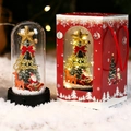 Christmas glass dome with miniature tree and deer next to a red festive gift box - Window Box Tree + Car + Santa