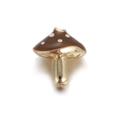 Macro shot of gold-plated mushroom charm with brown enamel and pink polka dots - Brown Mushroom Pink Dots