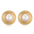 Macro shot of 18K gold plated heart earrings featuring a vintage textured pearl center - Round Pearl Textured Stud Earrings / Gold