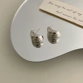 French style minimalist silver bead C-shaped stud earrings on reflective mirror surface - Silver