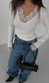 Close-up of white lace trim detail on a slim fit long-sleeve T-shirt for women - S / White