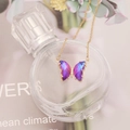 Golden butterfly necklace with purple and blue gradient crystal pendant on perfume bottle - Deep Purple