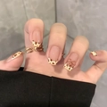Short square press-on nails with brown leopard print and bow tie accents on nude base - Leopard Bow (BY1673)