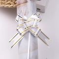 Elegant white pull bow ribbon with gold edges for gift wrapping and holiday decor - White Gold Edge