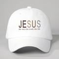 Close-up of the JESUS lettering and religious scripture print on a white cotton baseball cap - One Size / White