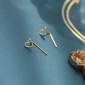 Elegant 925 silver minimalist golden hollow heart stud earrings on a blue textured surface - Brushed Hollow Heart / Gold