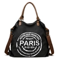 Black canvas tote bag with brown leather straps and Paris typography for daily commute - Black