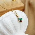 Golden clover necklace with colorful pear-cut gemstones hanging on a white stone vessel - Flower Petal / Multicolor Petal (N0055-1)
