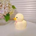Cute yellow duck night light with pink ribbon, warm glowing cartoon vinyl lamp for kids - Large Duck - Pink