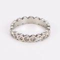 Macro shot of silver stainless steel eternity ring featuring polished bezel-set cubic zirconia - US 6 / Steel