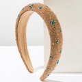 Detail of padded headband with emerald green stars and dense crystal rhinestones - Brown