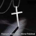 Macro detail of polished titanium steel cross pendant with a shiny mirror finish - Smooth Cross
