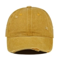 Detail of vintage washed cotton baseball cap with distressed torn edges in mustard yellow - Orange