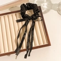 Floral black satin scrunchie with elegant long ribbon and bow design for hair - Black Ribbon Style