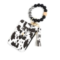 Cow print leather card holder set with black beaded wristlet and matching tassel charm - Big Spotted Cow