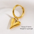 Detailed macro view of 16mm golden heart hoop earring weighing 3.1g on white fabric - Heart