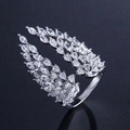 Macro detail of silver wings open ring with pavé marquise and pear zircon stones - Adjustable Open / White Gold