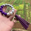Detail of colorful silicone beaded bracelet keychain with purple tassel and gold clasp - Style 4-Purple Grey Marble White/Purple Tassel