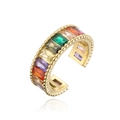 Macro shot of colorful baguette-cut zircon stones on a gold-plated beaded open ring band - Gold Multicolor Zirconia