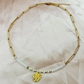 Bohemian gold stainless steel necklace featuring a monstera leaf pendant and white beads - White