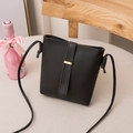 Classic black minimalist bucket bag with gold metal trim and slim shoulder strap - Black