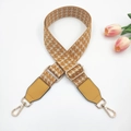 Detail of adjustable woven bag strap with golden metal hooks and yellow geometric pattern - Silver Clasp / Yellow Beige with Yellow Leather
