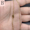 Detail van een 18K vergulde Figaro schakelketting met een metalen kreeftensluiting - figaro ketting