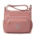 Pink waterproof nylon crossbody bag with multi-zipper pockets and adjustable strap - Pink