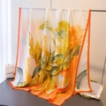 Detailed view of vibrant orange silk scarf with abstract green floral patterns and smooth texture - 180*80cm / Orange (XD38-2)