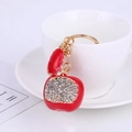 Close-up of a red apple keychain with sparkling rhinestones and golden metal hardware - Red Rhinestone Apple (Premium)