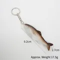 Realistic dried fish keychain with 9.2cm length and detailed brown-grey texture finish - Curved Salted Fish (Keychain)