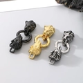 Detail of lion and wolf head metal connectors for jewelry in black, gold, and silver - Double Lion / Gold