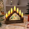 Dettaglio di 7 candele LED e scena di Babbo Natale in una lanterna musicale in bronzo - Casa con renna volante
