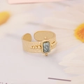 Macro shot of gold hammered ring featuring a white turquoise stone and beaded edges - Rectangular Turquoise Hammered Beaded (6#)