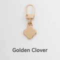 Universal clover gold zipper puller replacement for suitcases and jackets on white background - Gold Clover