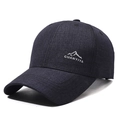 Dark blue denim textured baseball cap featuring a silver mountain peak graphic print - Navy Blue