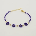Golden chain bracelet with deep blue crystal flower beads and adjustable lobster clasp - Blue (Bracelet)
