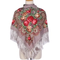 Ethnic taupe shawl with red rose print and long silky fringe on a mannequin - Khaki